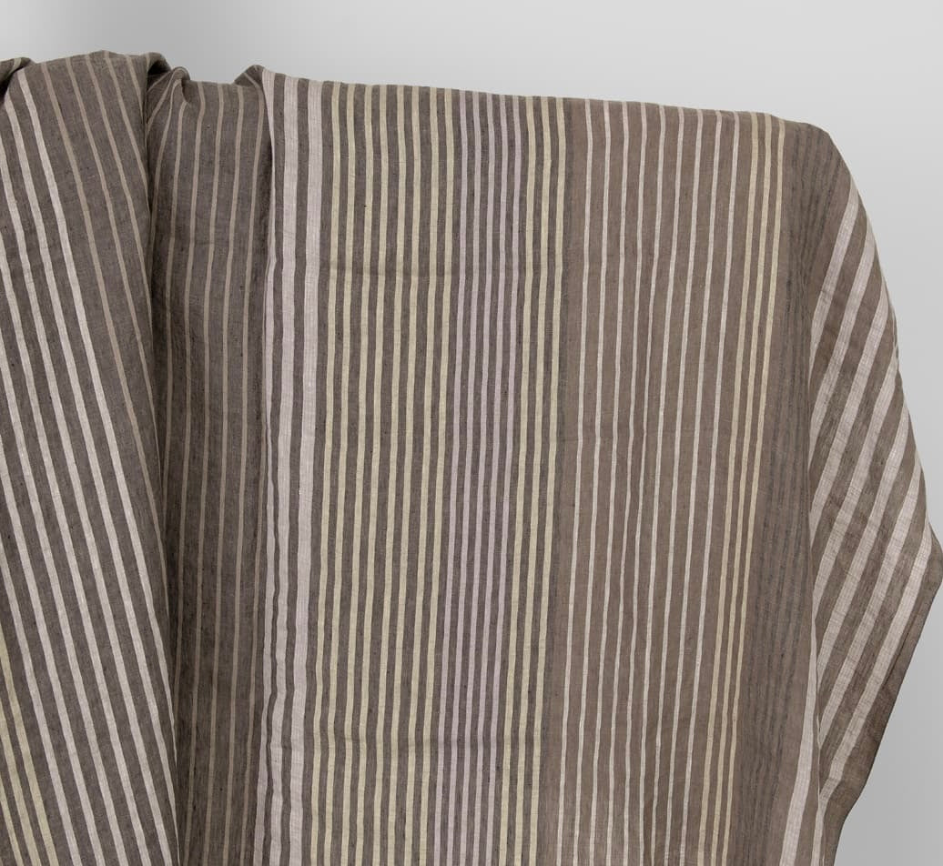 Close-up of brown and beige striped fabric on a white background
