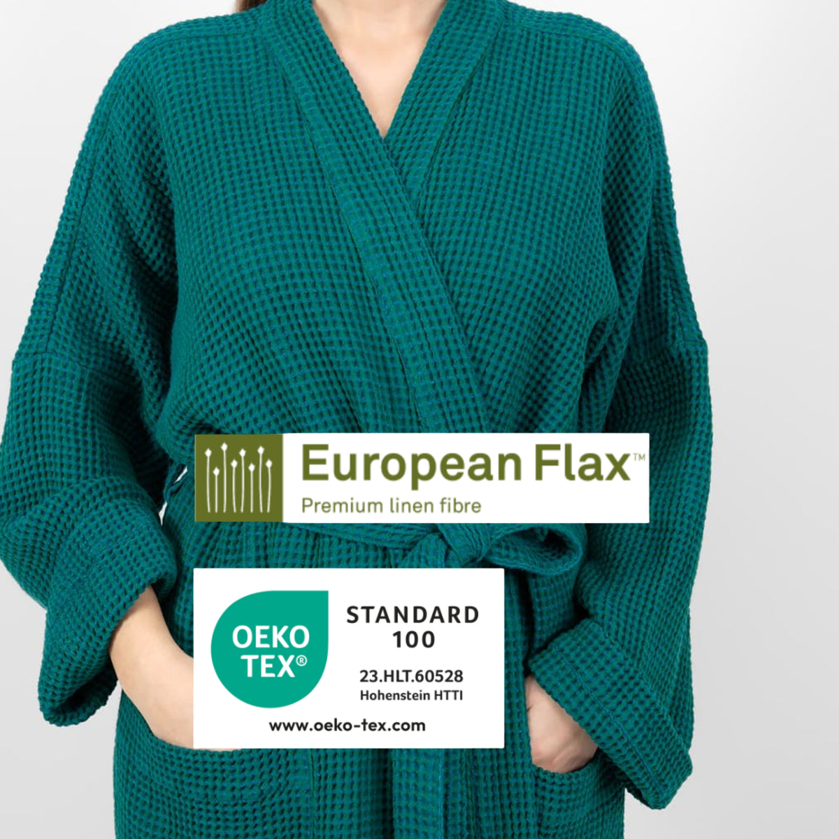 A person wearing a teal green waffle-knit bathrobe against a light gray background, with two white certification-style labels overlaid across the chest reading European Flax and OEKO-TEX Standard 100.