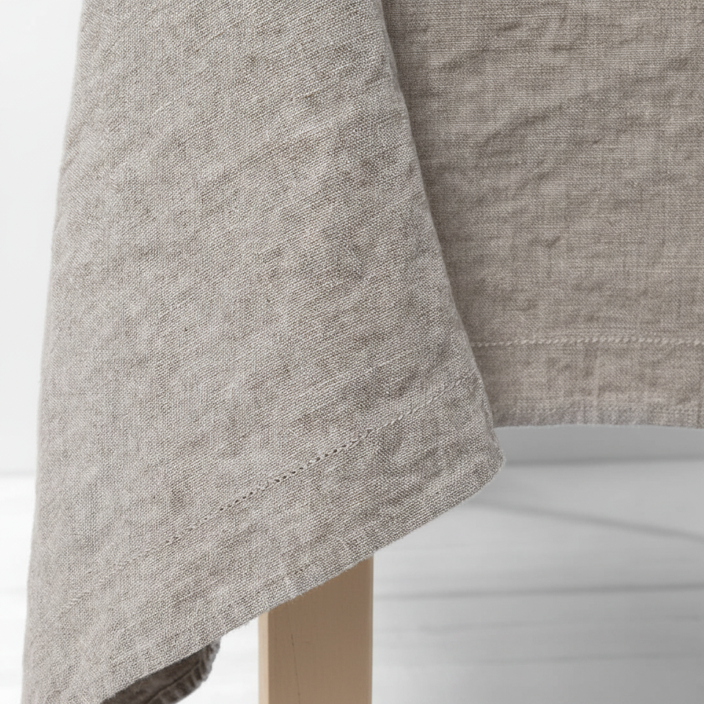 Linen tablecloth — sand legs, no logo